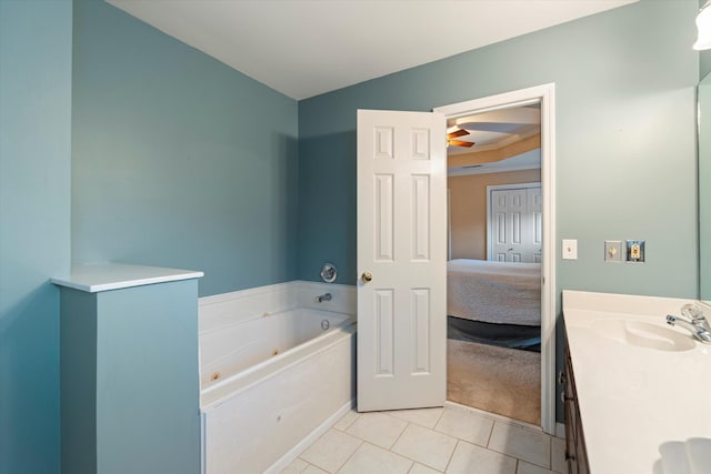 bathroom with tile patterned floors, vanity, and a bathtub