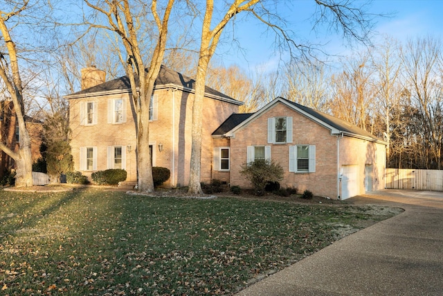 view of front of home featuring a garage and a front lawn