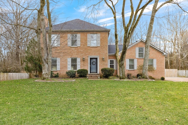 colonial home featuring a front yard