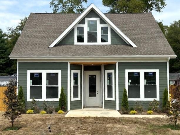 view of front of house with a shingled roof