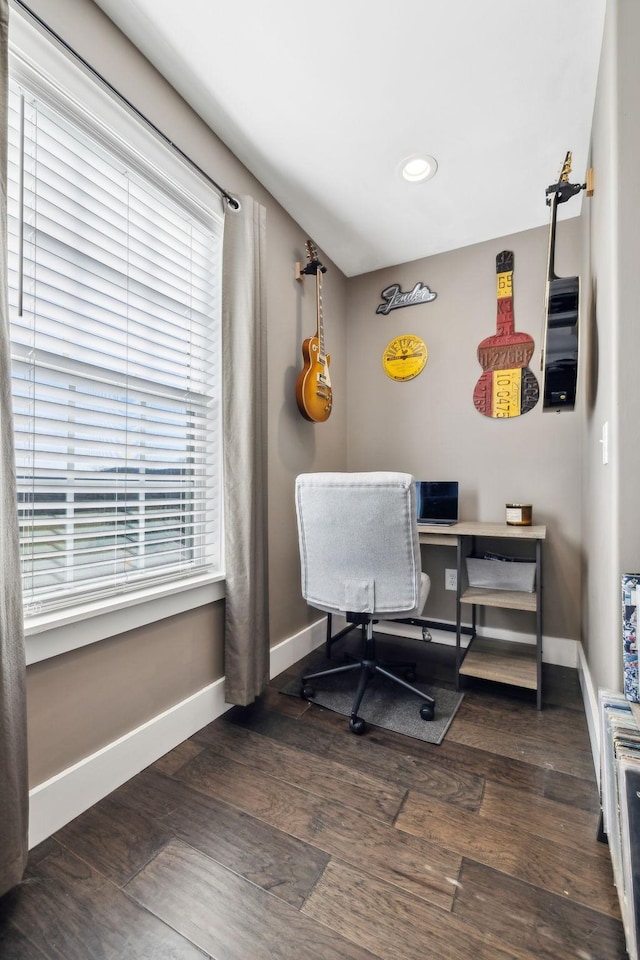 office space with dark wood-type flooring