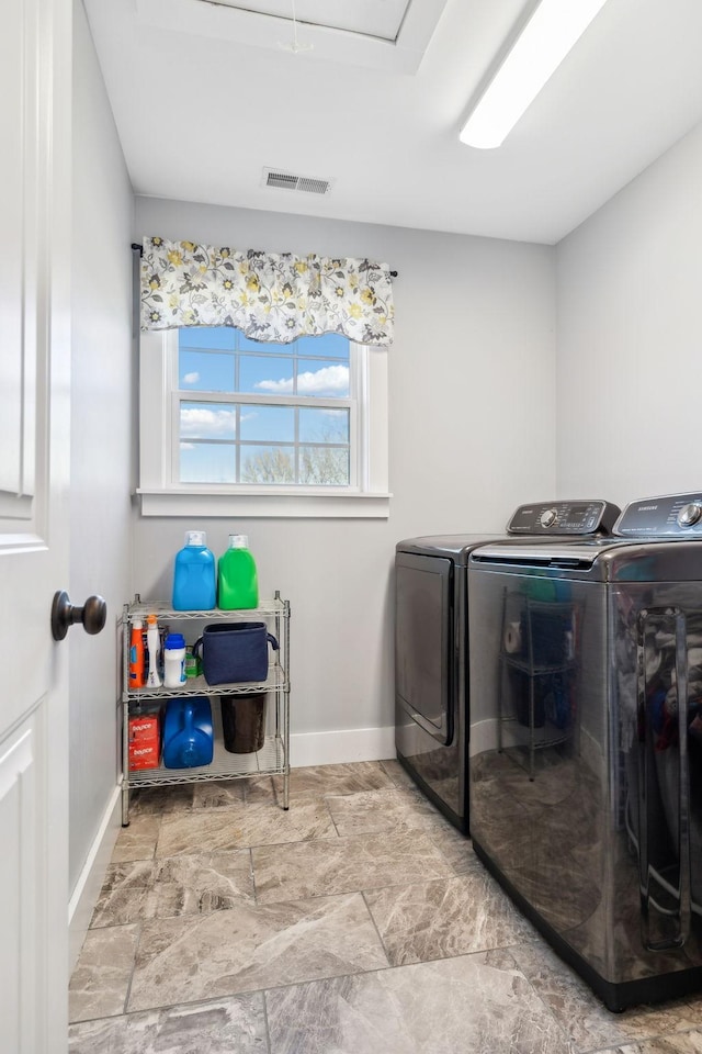 laundry area with washer and clothes dryer