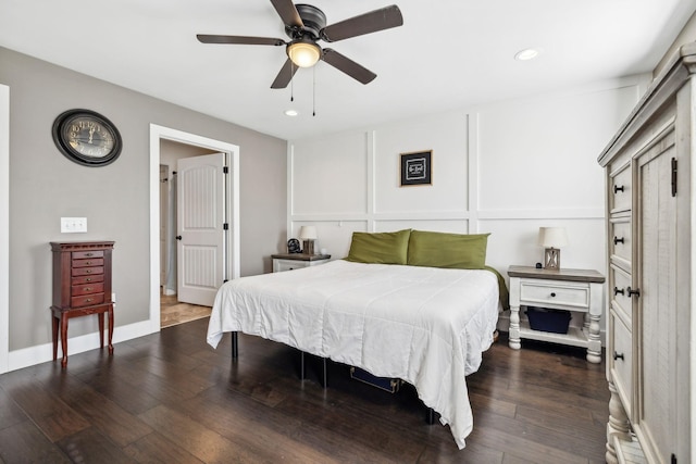 bedroom featuring dark hardwood / wood-style flooring and ceiling fan