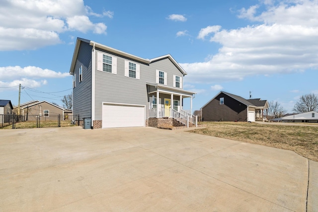 view of front facade with a garage and covered porch