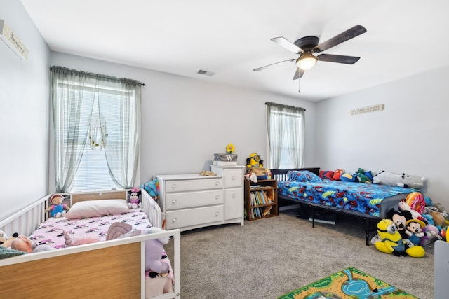 carpeted bedroom featuring ceiling fan