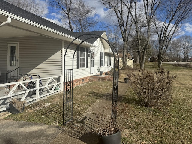 view of home's exterior with a lawn