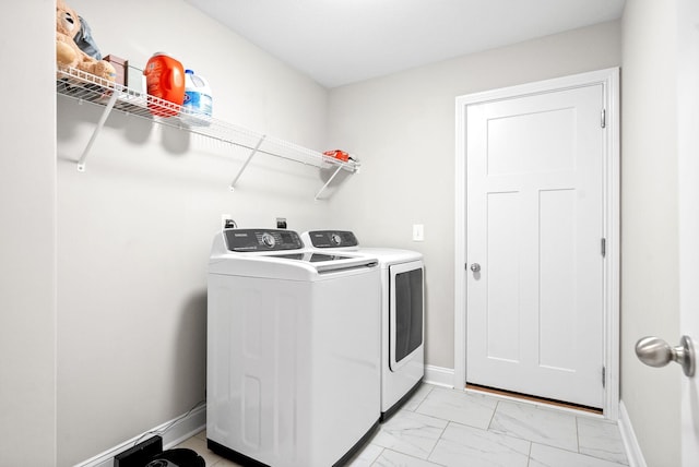 laundry area featuring washer and clothes dryer