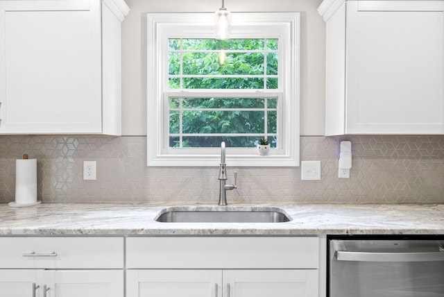 kitchen with sink, stainless steel dishwasher, and white cabinets