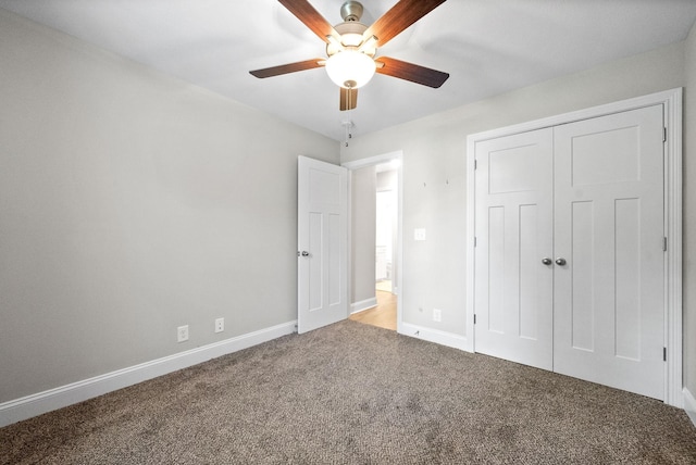 unfurnished bedroom with carpet floors, a closet, and ceiling fan