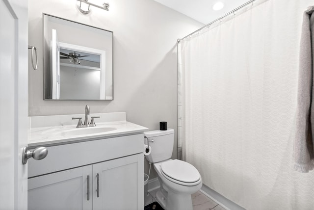 bathroom featuring vanity, a shower with shower curtain, and toilet