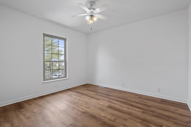 spare room featuring ceiling fan and wood-type flooring