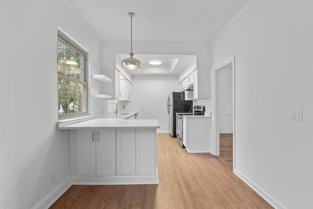 kitchen with white cabinetry, stainless steel electric range oven, decorative light fixtures, kitchen peninsula, and light wood-type flooring