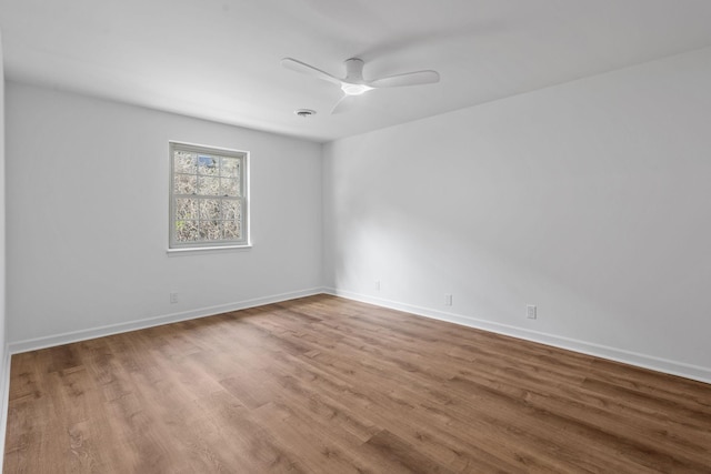 empty room featuring ceiling fan and light hardwood / wood-style floors