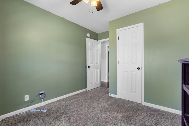 unfurnished bedroom with ceiling fan and carpet flooring