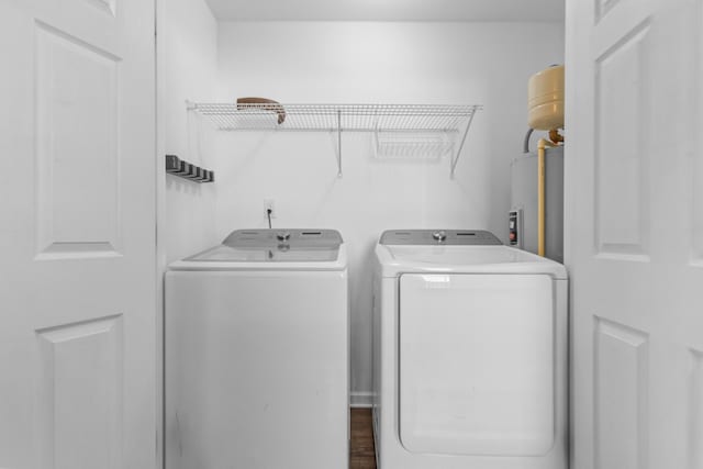 laundry room featuring independent washer and dryer and electric water heater