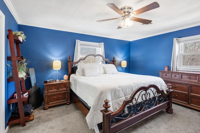 bedroom with multiple windows, crown molding, light colored carpet, and ceiling fan