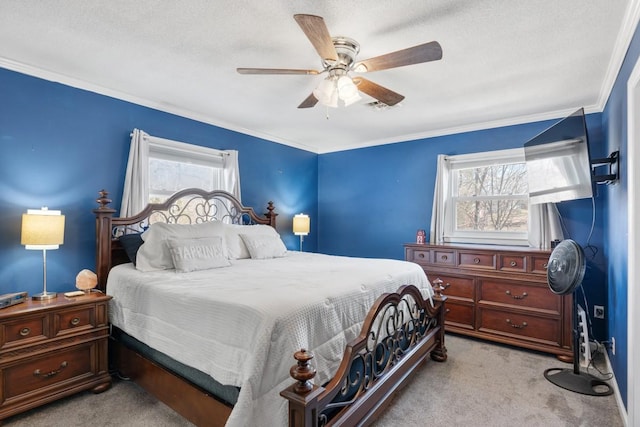 carpeted bedroom featuring crown molding, ceiling fan, and a textured ceiling