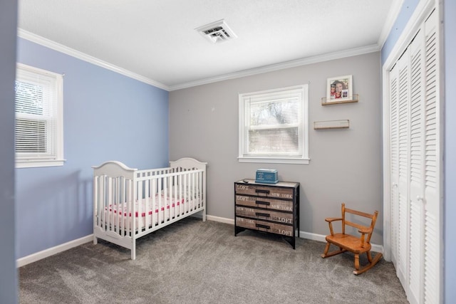 bedroom with multiple windows, ornamental molding, and a closet