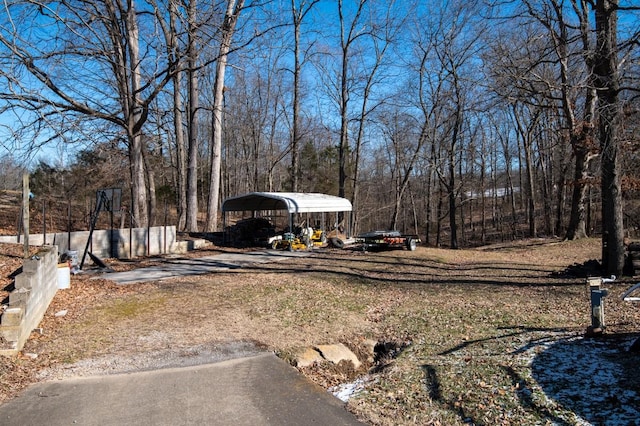 view of yard with a carport