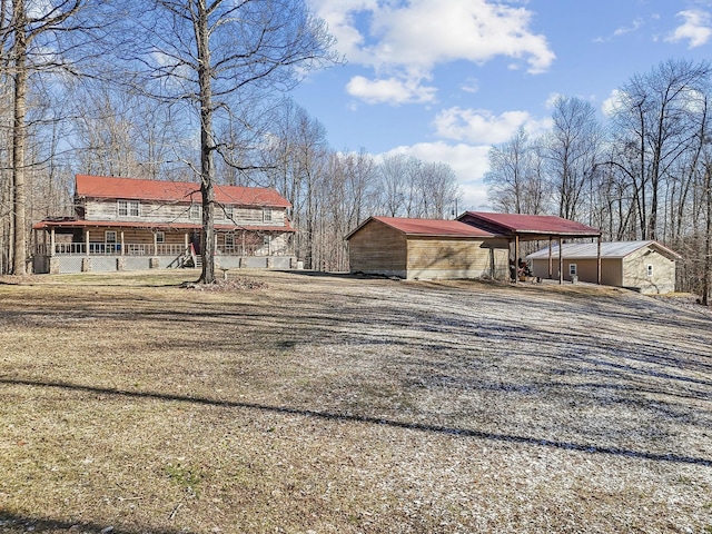 view of front facade featuring a porch and a carport