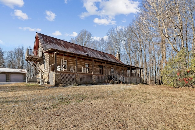 view of front of property featuring covered porch and a front lawn