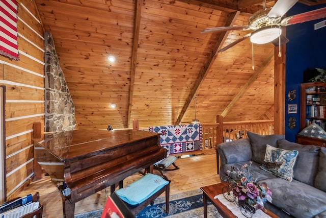 interior space featuring vaulted ceiling with beams, wood ceiling, wooden walls, and hardwood / wood-style floors