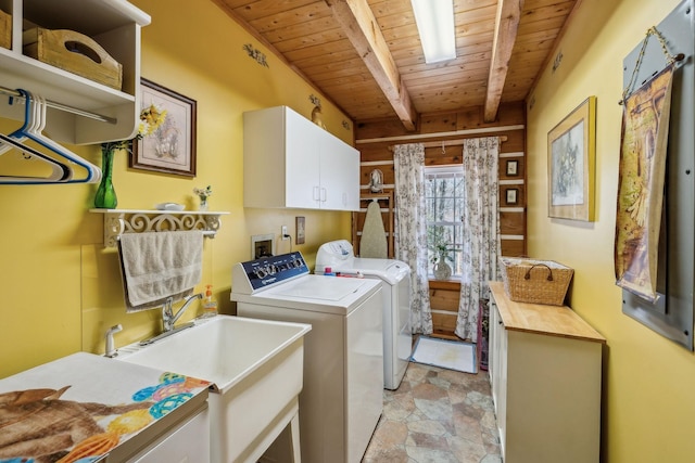 clothes washing area featuring cabinets, sink, wooden ceiling, and independent washer and dryer