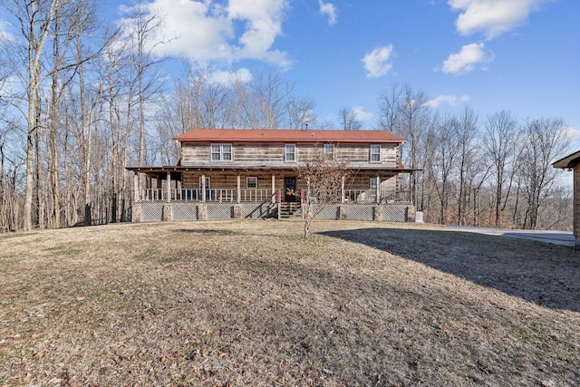 exterior space with a lawn and covered porch