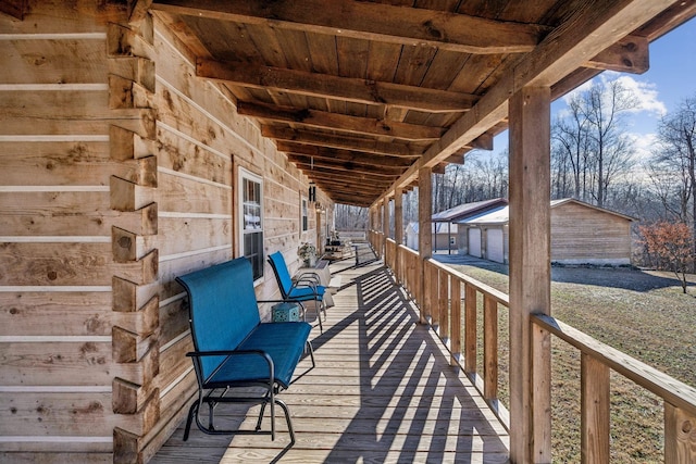 wooden deck featuring an outbuilding