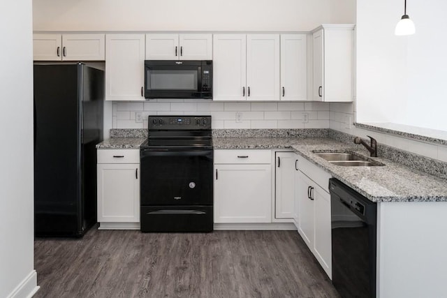 kitchen featuring white cabinetry, pendant lighting, sink, and black appliances