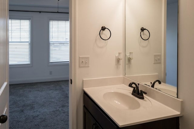 bathroom with plenty of natural light and vanity