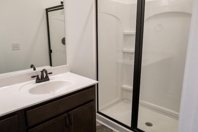 bathroom with vanity and walk in shower