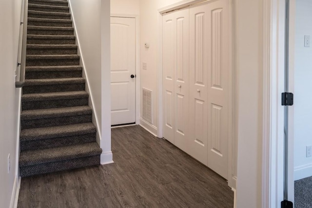 stairway featuring hardwood / wood-style flooring