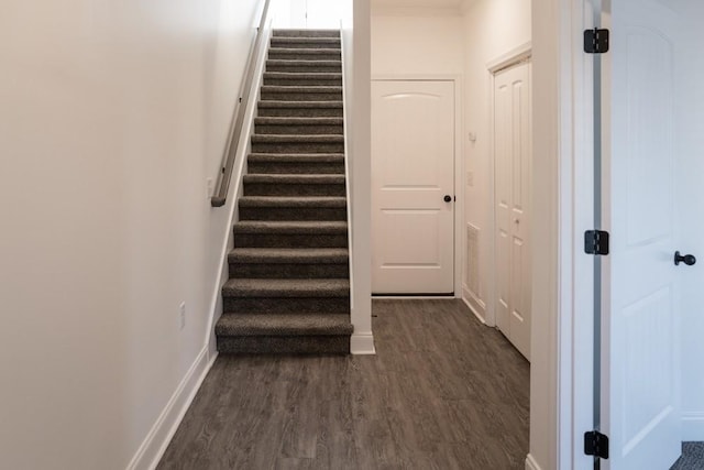 stairway featuring hardwood / wood-style floors