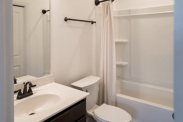 full bathroom with vanity, shower / bath combination with curtain, and toilet