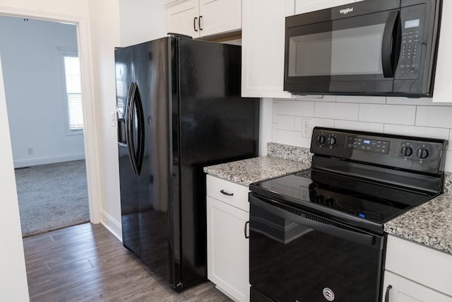 kitchen with white cabinetry, light stone counters, tasteful backsplash, and black appliances