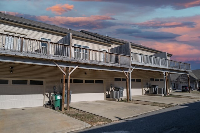 view of front facade featuring a balcony and a garage