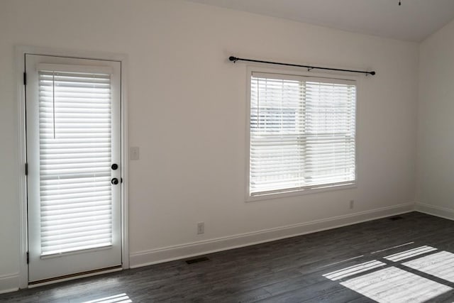 empty room with dark hardwood / wood-style floors