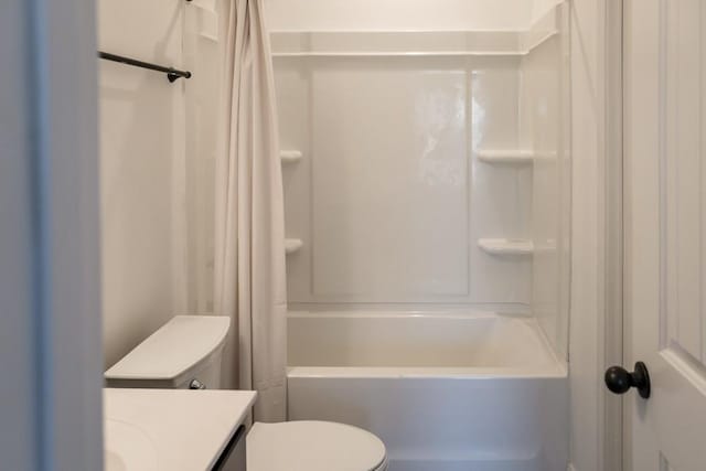 full bathroom featuring vanity, shower / bath combination with curtain, and toilet