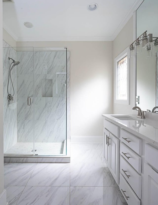 bathroom featuring vanity, a shower with door, and ornamental molding