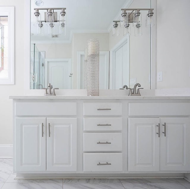 bathroom featuring vanity, crown molding, and walk in shower