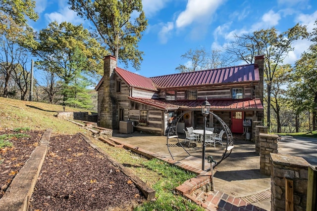 back of house featuring a patio