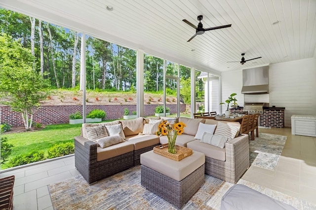 view of patio with exterior kitchen, a grill, an outdoor hangout area, and ceiling fan