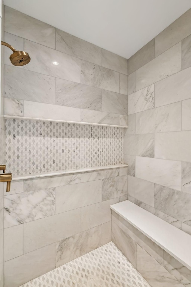 bathroom featuring tiled shower