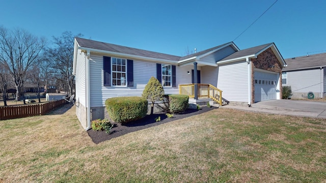 view of front of house featuring a garage and a front yard