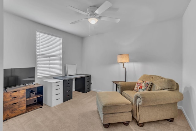 office area with ceiling fan and light carpet