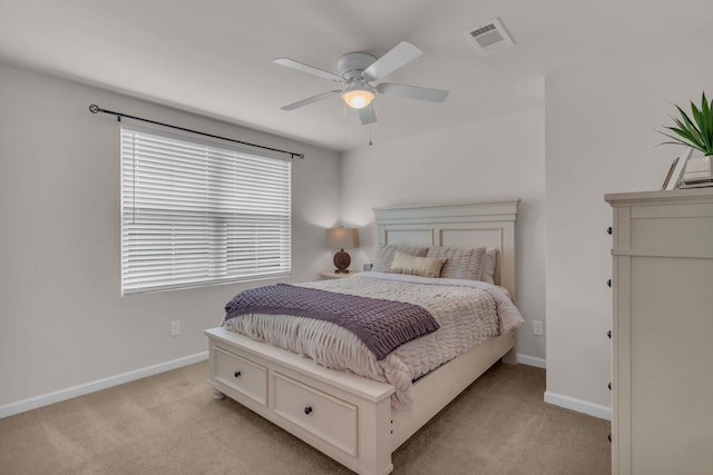 bedroom with light colored carpet and ceiling fan