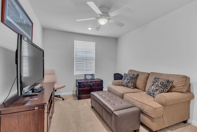 living room with light colored carpet and ceiling fan