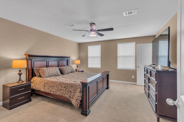 bedroom with light carpet and ceiling fan