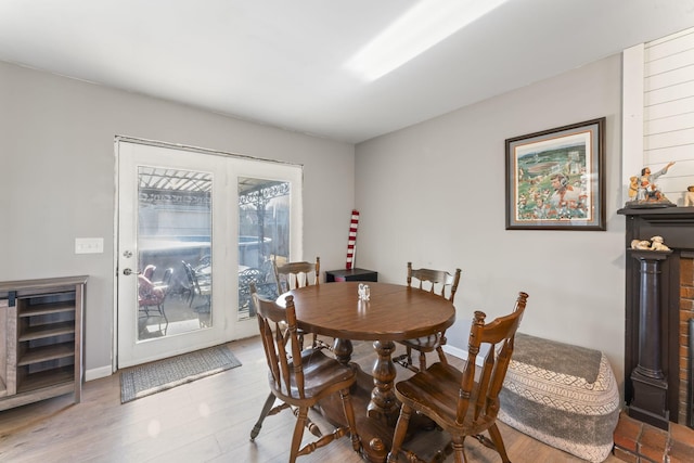 dining room with beverage cooler and light wood-type flooring